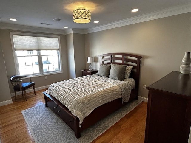 bedroom featuring ornamental molding and dark hardwood / wood-style floors