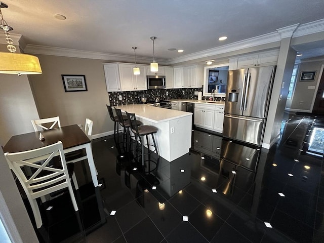 kitchen featuring a breakfast bar, pendant lighting, white cabinets, backsplash, and stainless steel appliances