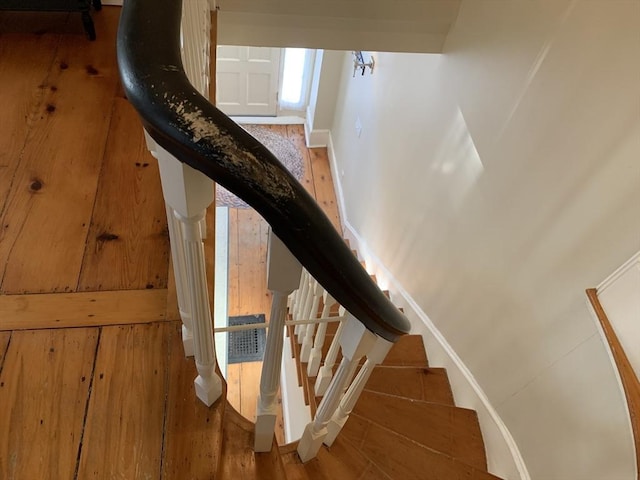 staircase featuring baseboards