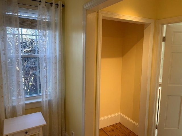 interior details with wood finished floors and baseboards