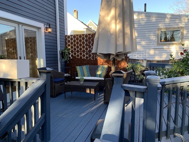 wooden terrace with outdoor lounge area