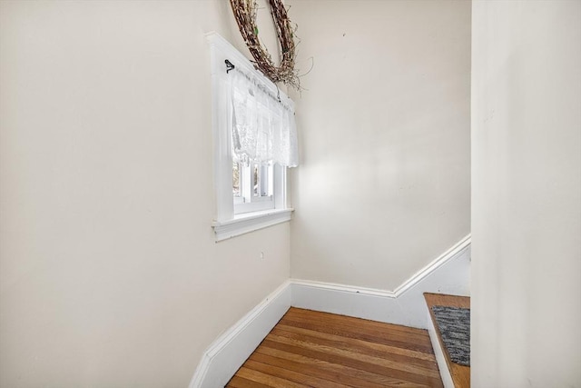 details featuring baseboards and wood finished floors