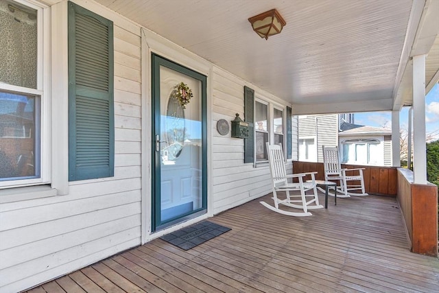 wooden terrace featuring a porch