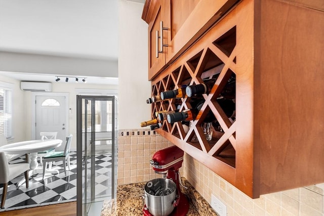 wine area with light floors and a wall mounted air conditioner