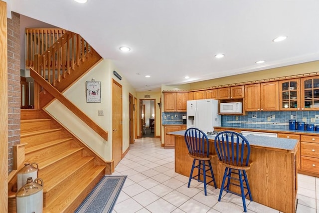 213 N Worcester St, Norton, MA 02766 - kitchen with white appliances, light tile patterned floors, tasteful backsplash, a kitchen island, and recessed lighting