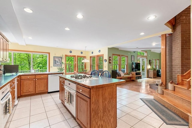 213 N Worcester St, Norton, MA 02766 - kitchen with white appliances, light tile patterned floors, a center island, open floor plan, and recessed lighting