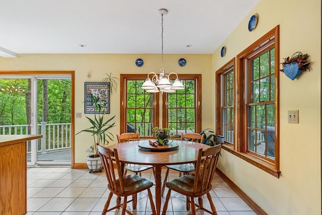 213 N Worcester St, Norton, MA 02766 - dining area with light tile patterned floors, a chandelier, plenty of natural light, and baseboards