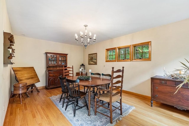 213 N Worcester St, Norton, MA 02766 - dining area featuring a chandelier, light wood-style flooring, and baseboards