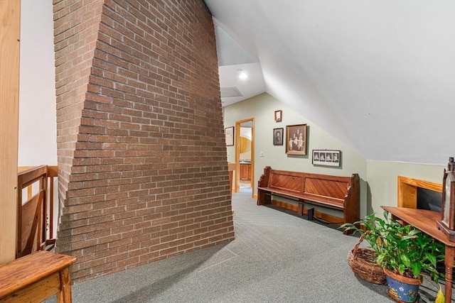 213 N Worcester St, Norton, MA 02766 - hallway featuring brick wall, vaulted ceiling, and carpet