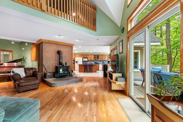 213 N Worcester St, Norton, MA 02766 - living room with a wood stove and light wood-style floors