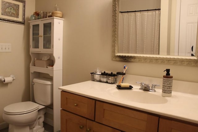 bathroom with vanity and toilet