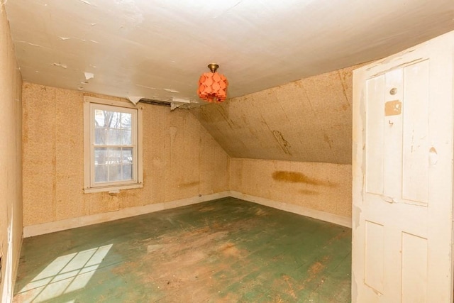 additional living space featuring vaulted ceiling