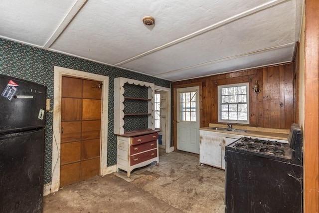 kitchen with sink and black appliances