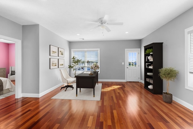 office with hardwood / wood-style floors and ceiling fan