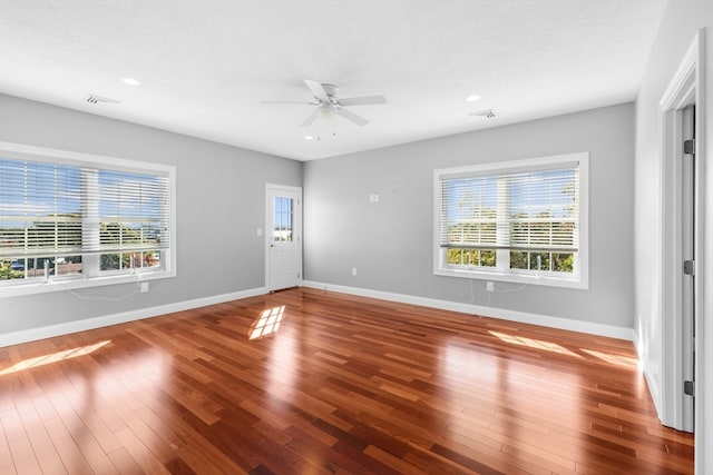 unfurnished room featuring hardwood / wood-style flooring and ceiling fan