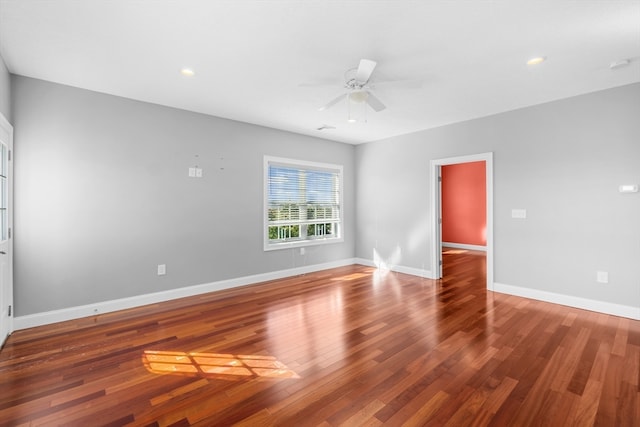 spare room with wood-type flooring and ceiling fan