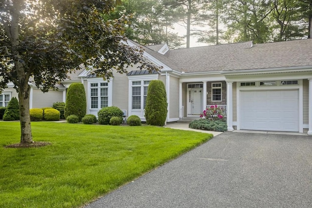 24 High Pines Cir Unit 24, Wilbraham, MA 01095 - view of front of house with an attached garage, a front yard, and asphalt driveway