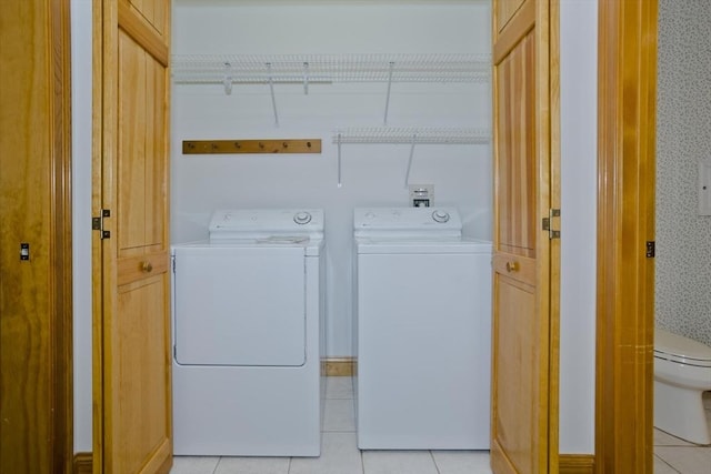24 High Pines Cir Unit 24, Wilbraham, MA 01095 - laundry area with washing machine and clothes dryer and light tile patterned flooring