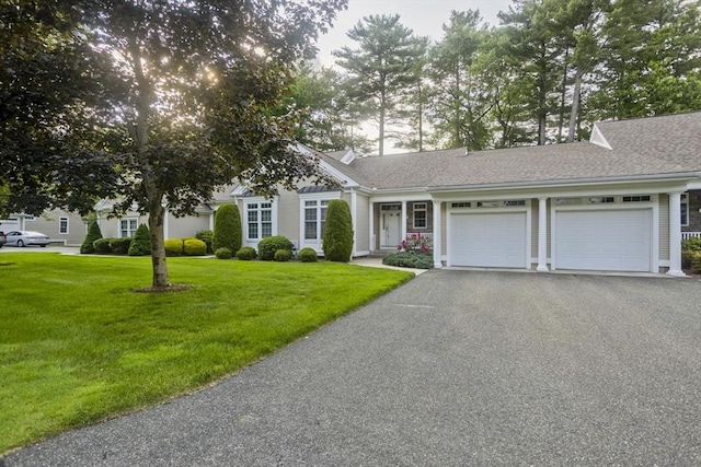 24 High Pines Cir Unit 24, Wilbraham, MA 01095 - view of front of property featuring an attached garage, asphalt driveway, a front lawn, and a shingled roof