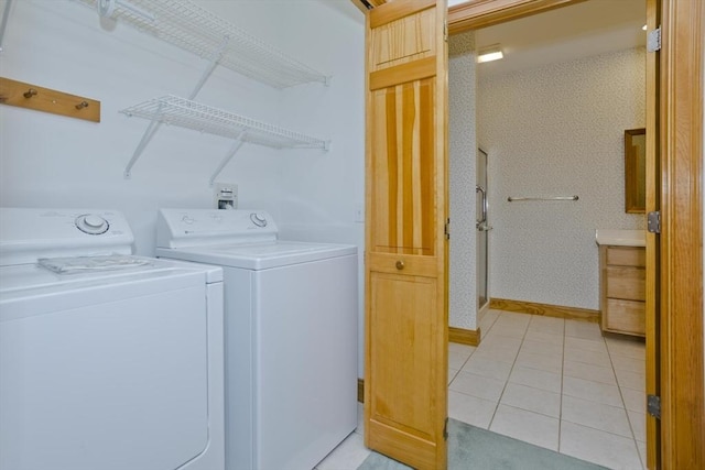 24 High Pines Cir Unit 24, Wilbraham, MA 01095 - washroom featuring washing machine and dryer, light tile patterned floors, and baseboards