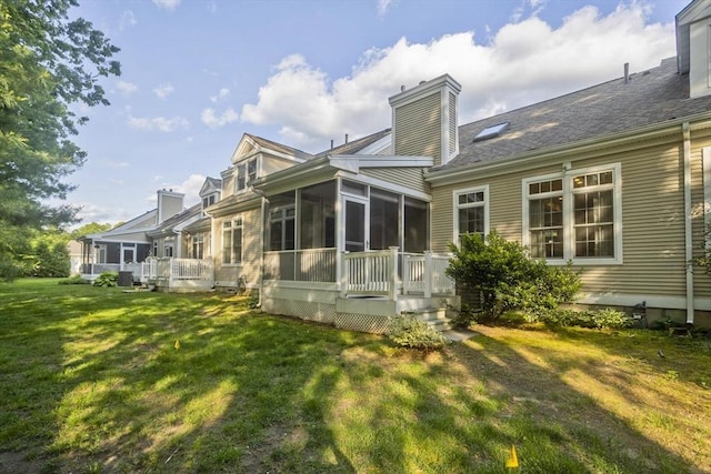 24 High Pines Cir Unit 24, Wilbraham, MA 01095 - rear view of property featuring a sunroom, a chimney, a lawn, and a shingled roof