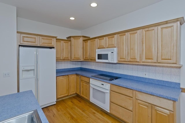 24 High Pines Cir Unit 24, Wilbraham, MA 01095 - kitchen with white appliances, light wood-style flooring, decorative backsplash, recessed lighting, and a sink