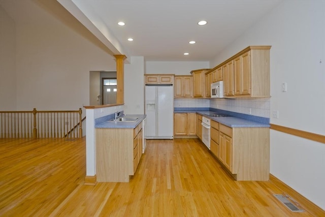 24 High Pines Cir Unit 24, Wilbraham, MA 01095 - kitchen featuring white appliances, a sink, light brown cabinets, light wood-style floors, and tasteful backsplash