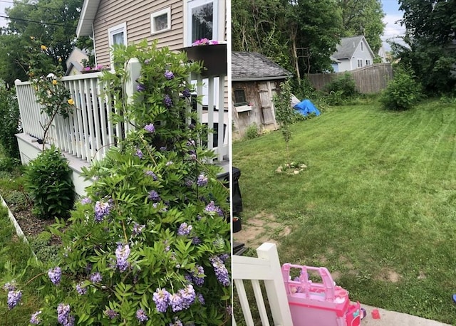 view of yard featuring fence and a wooden deck