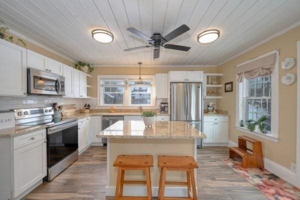 kitchen with stainless steel appliances, wood ceiling, and open shelves