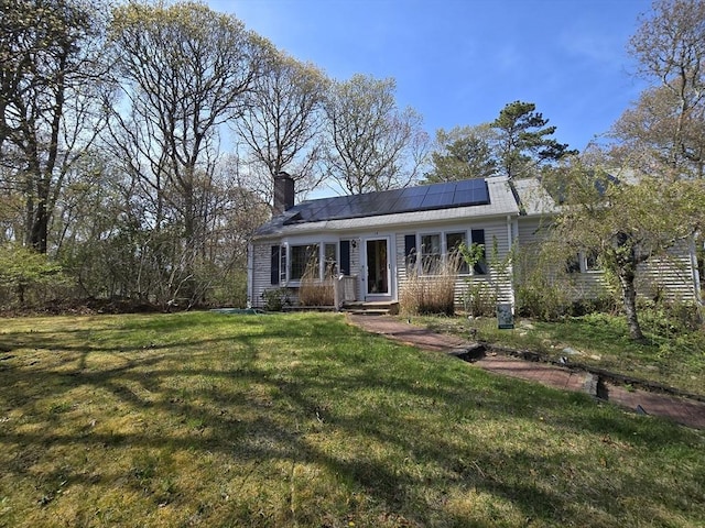 14 Many Oaks Cir, Yarmouth, MA 02675 - view of front of property with solar panels, a chimney, and a front yard