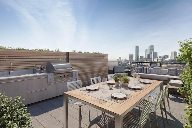 view of patio / terrace featuring area for grilling and sink