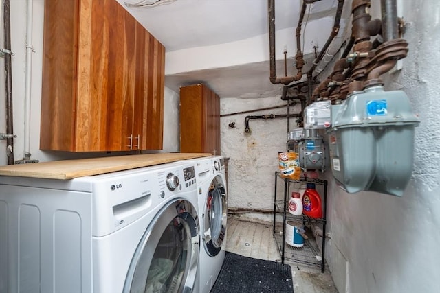 49 Revere St Unit 4, Boston, MA 02114 - laundry area featuring washing machine and clothes dryer and cabinet space