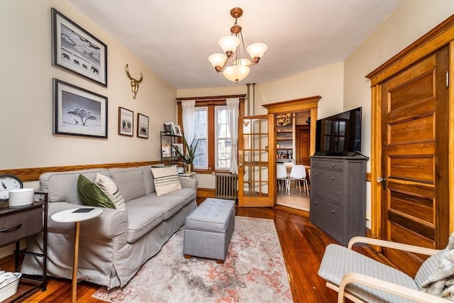 49 Revere St Unit 4, Boston, MA 02114 - living area with a chandelier and dark wood-style floors