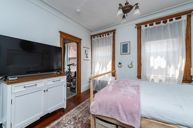 49 Revere St Unit 4, Boston, MA 02114 - bedroom featuring dark wood-style floors, a chandelier, and ornamental molding