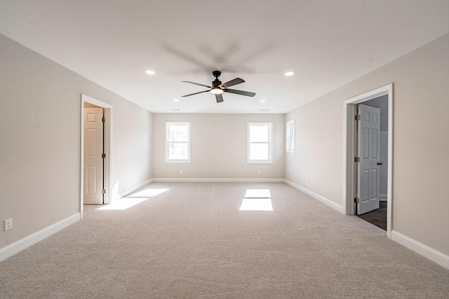 unfurnished room featuring ceiling fan and carpet flooring