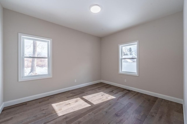 unfurnished room featuring hardwood / wood-style floors