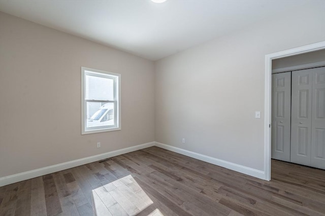 empty room with light hardwood / wood-style flooring