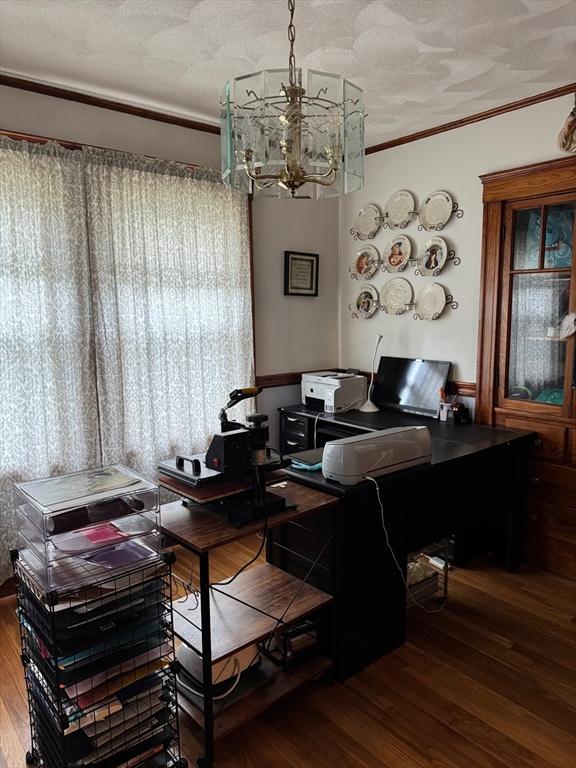 194 Fells Ave, Medford, MA 02155 - dining area with a chandelier, wood finished floors, crown molding, a textured ceiling, and a desk