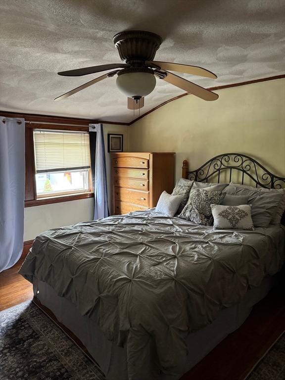 194 Fells Ave, Medford, MA 02155 - bedroom featuring a textured ceiling, wood finished floors, ceiling fan, and ornamental molding