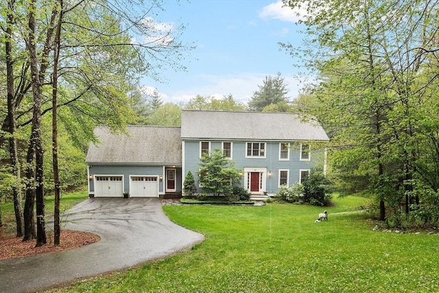 87 Wheeler Rd, Stow, MA 01775 - colonial house featuring asphalt driveway, an attached garage, and a front yard