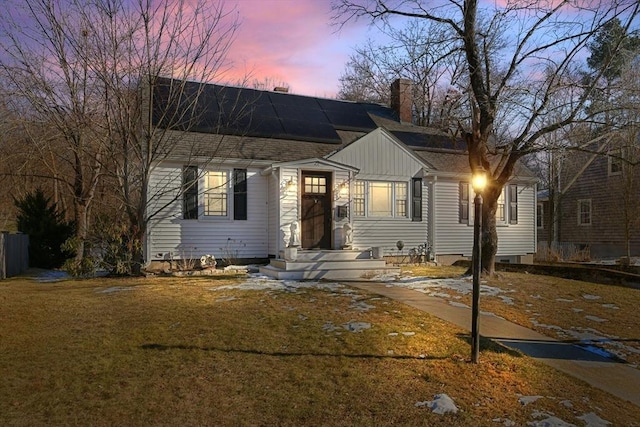 view of front of property with a lawn