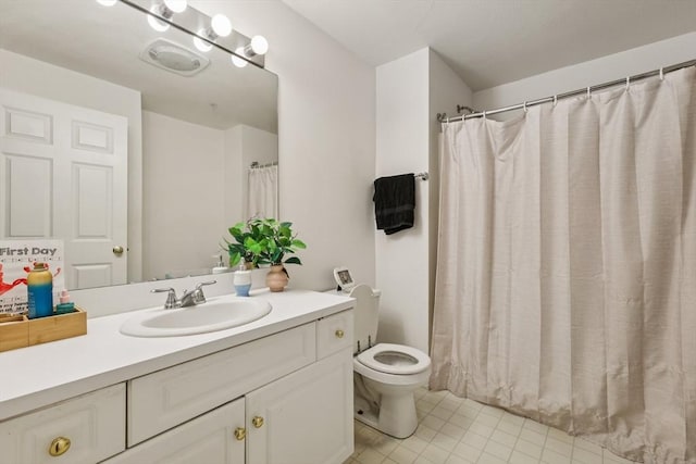 1 Riverview Blvd Unit 2-106, Methuen, MA 01844 - bathroom with toilet, vanity, and tile patterned flooring