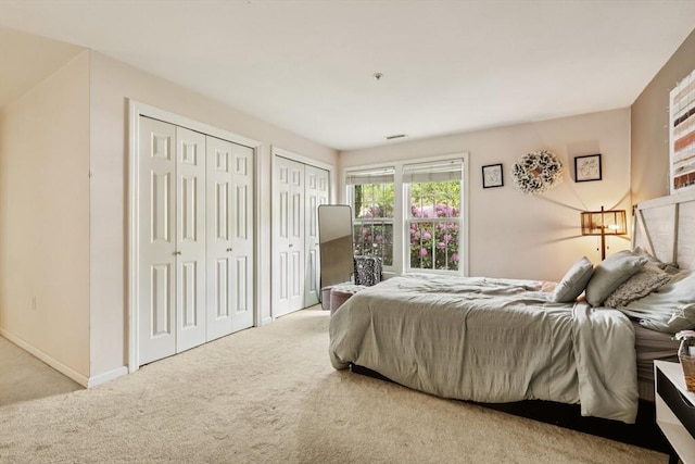 1 Riverview Blvd Unit 2-106, Methuen, MA 01844 - carpeted bedroom featuring multiple closets and baseboards