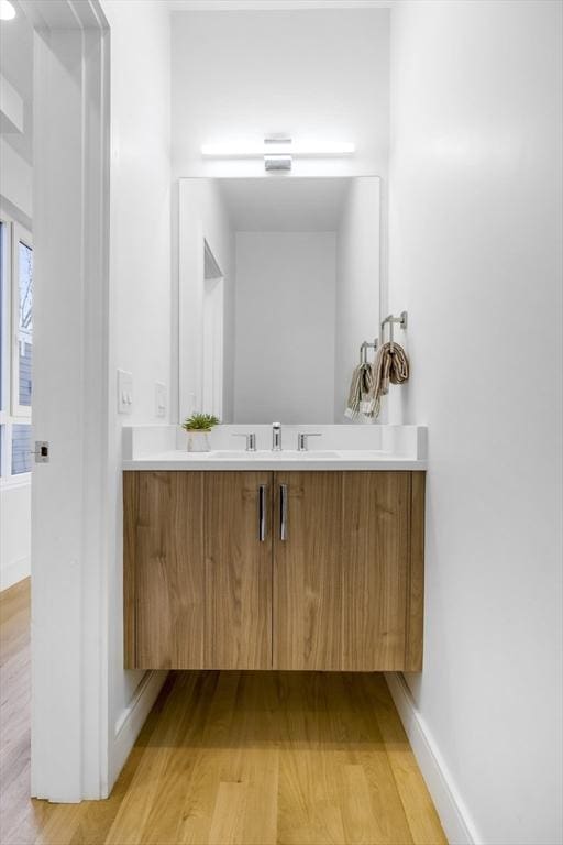 bathroom featuring vanity and hardwood / wood-style flooring