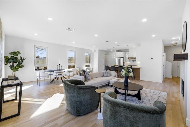 living room with light hardwood / wood-style flooring