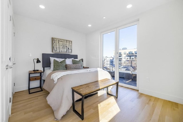 bedroom featuring access to outside and light hardwood / wood-style flooring