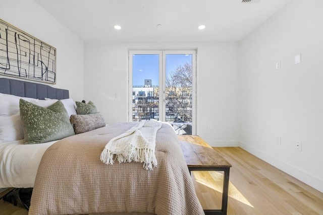 bedroom with wood-type flooring