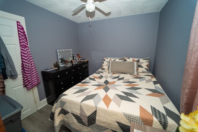 bedroom featuring ceiling fan and dark hardwood / wood-style floors