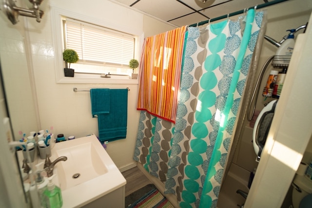 bathroom with shower with separate bathtub, hardwood / wood-style floors, and vanity