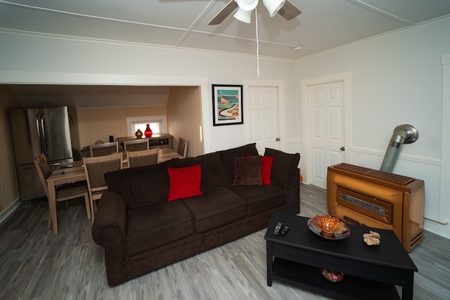 living room with ceiling fan and hardwood / wood-style floors